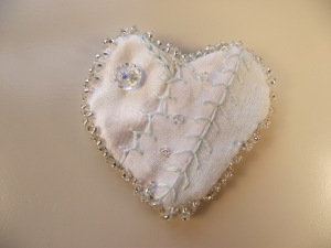 white on white with a touch of blue heart pin brooch